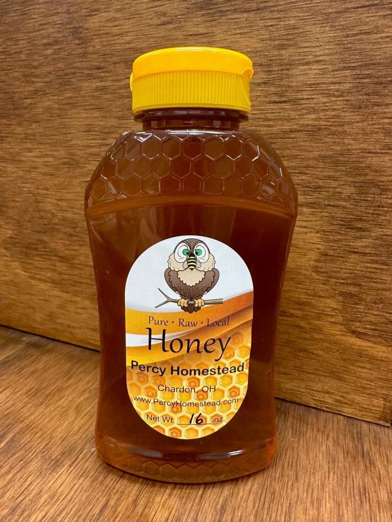 16 oz. (24 oz. Honey Weight) Ribbed Hourglass PET Honey Bottle with  Pressure Sensitive Liner Black Plastic Flip Top Lid